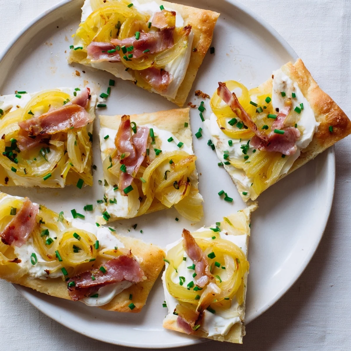 Deliciously creamy Mini Onion Tart Flammkuchen Bites perfect for appetizing gatherings.  