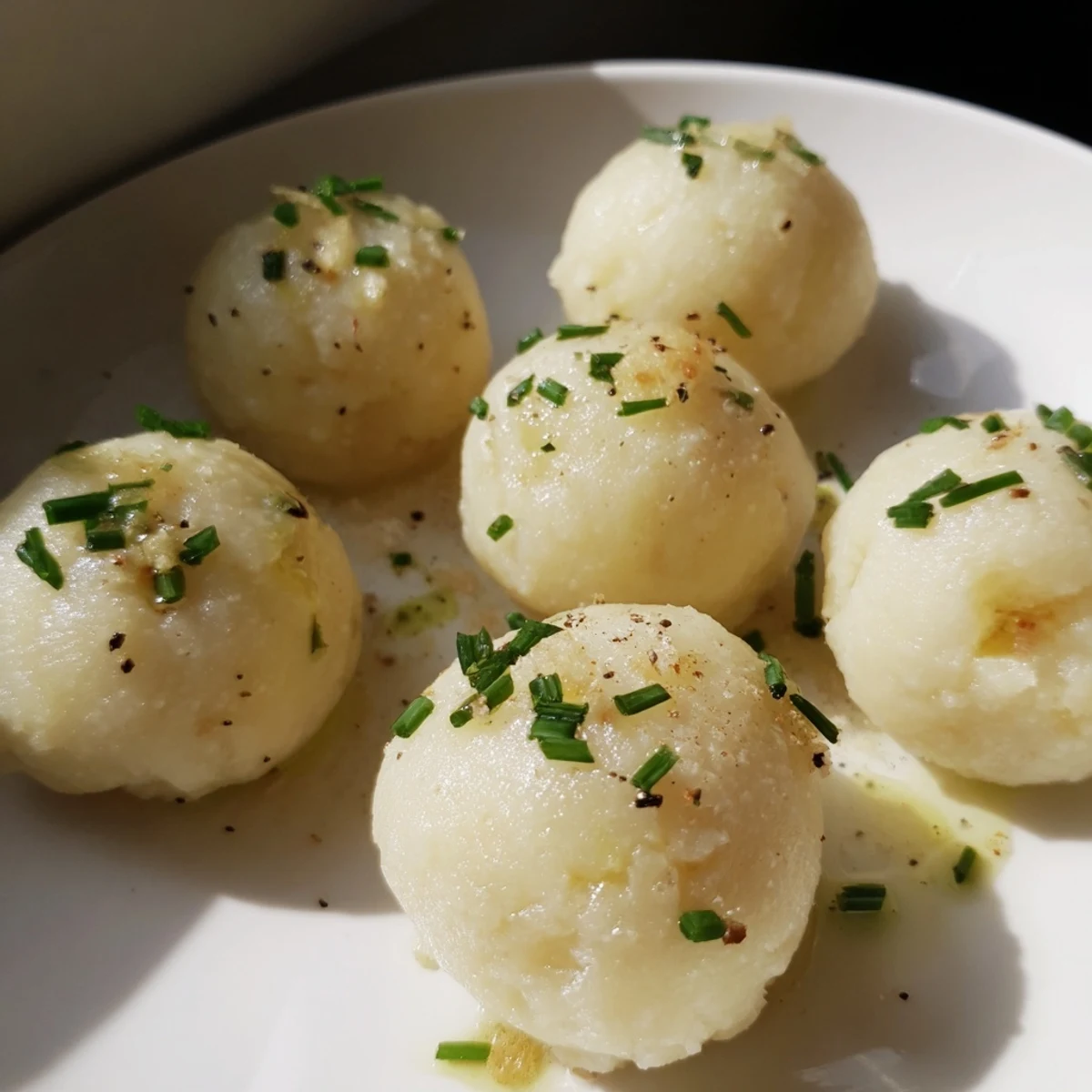 Imagine savory German potato dumplings, perfectly cooked and topped with chives and truffle oil.