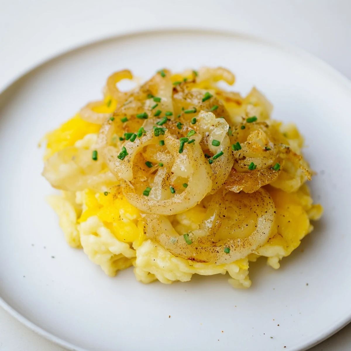 Freshly baked Käsespätzle, a classic German comfort food recipe with flavorful toppings.