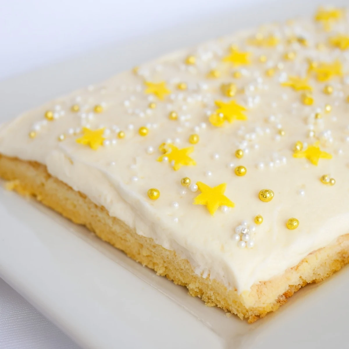 Buttery shortbread base holds the creamy vanilla frosting and star sprinkles of these Twinkle Twinkle Dessert Bars.