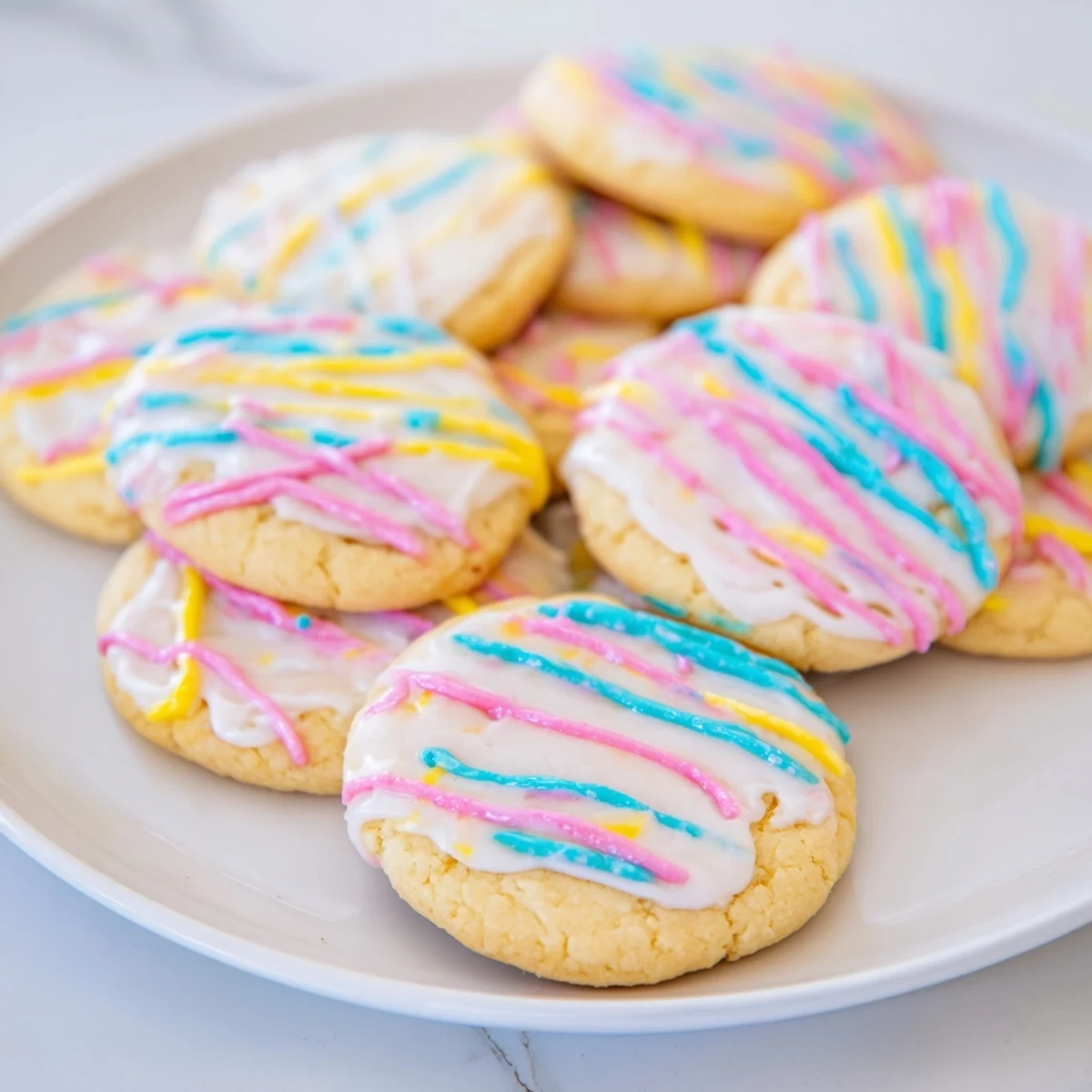 A close-up of sugar cookie and icing drizzle, offering a tempting treat ready to eat.