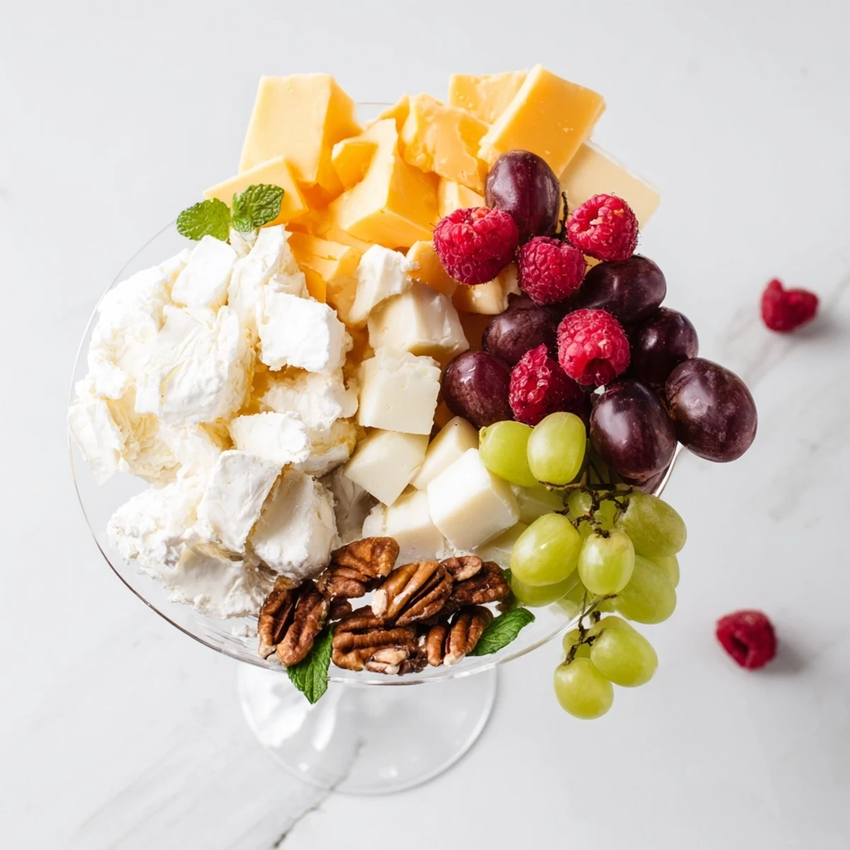 A cascade of grapes and cheeses create a beautiful Champagne Waterfall Board for your party.