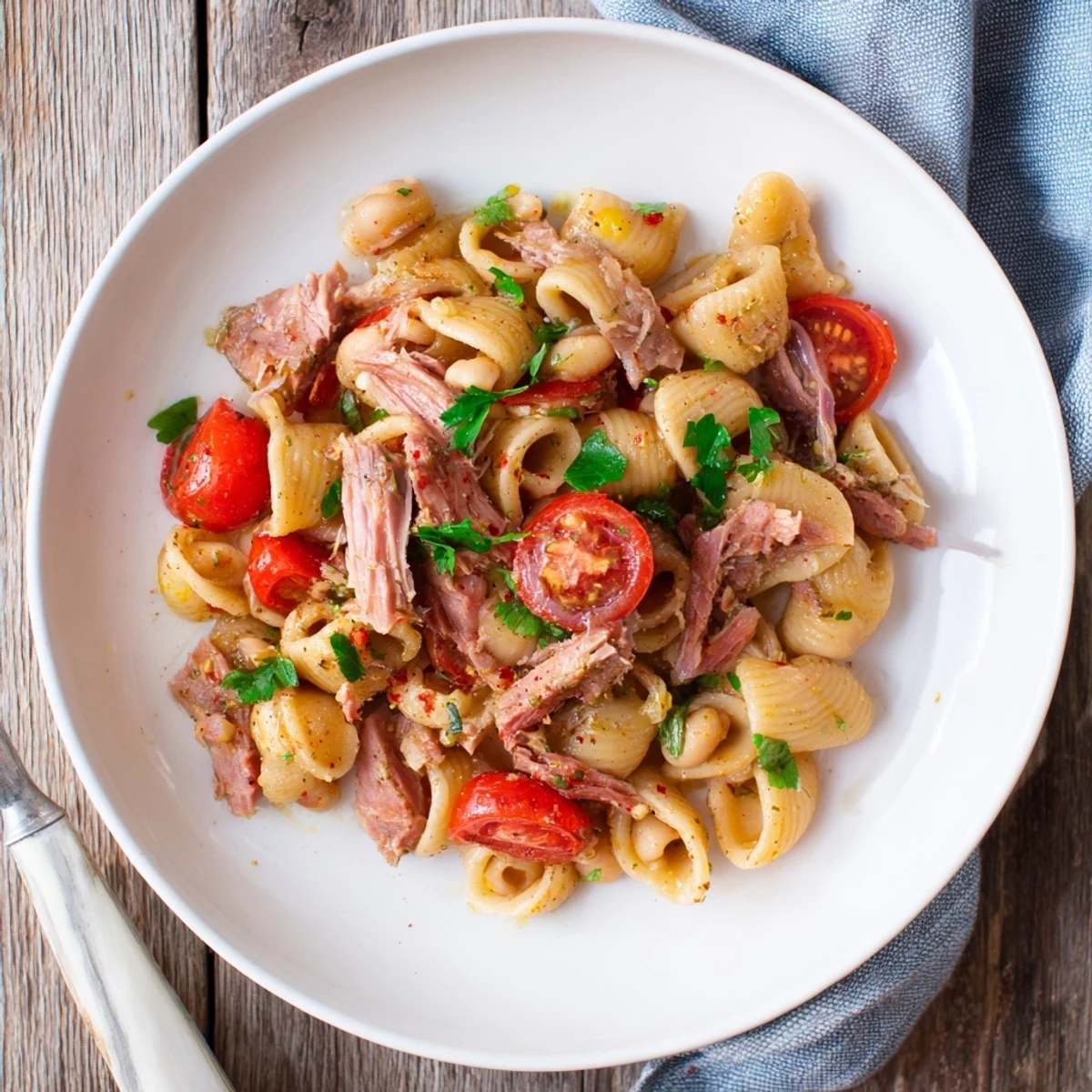 A bowl overflowing with a delicious Mediterranean-inspired Dense Chickpea and Tuna Salad.