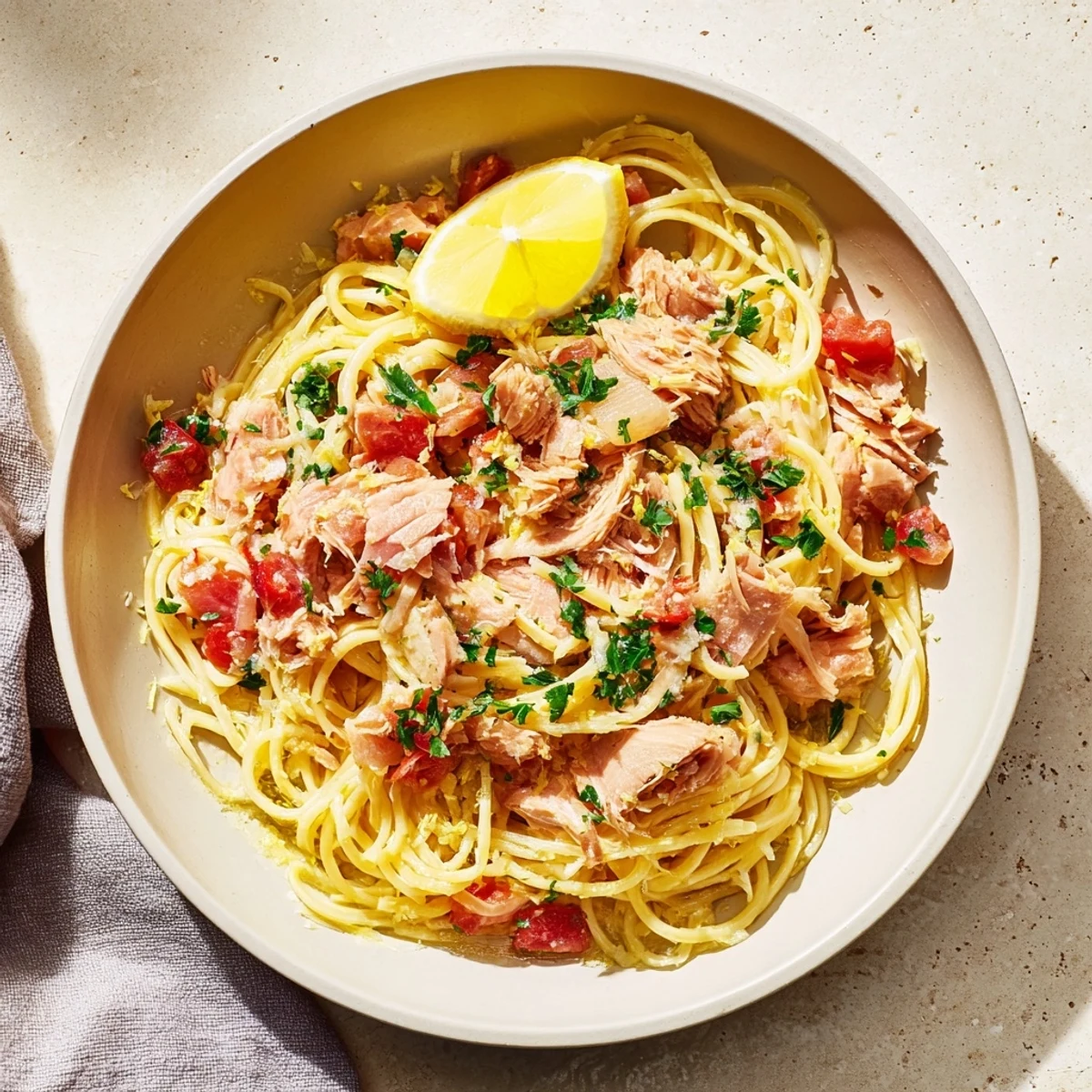 Golden strands of Lemon-Garlic Tuna Spaghetti, with a perfect toss of garlic and parsley.