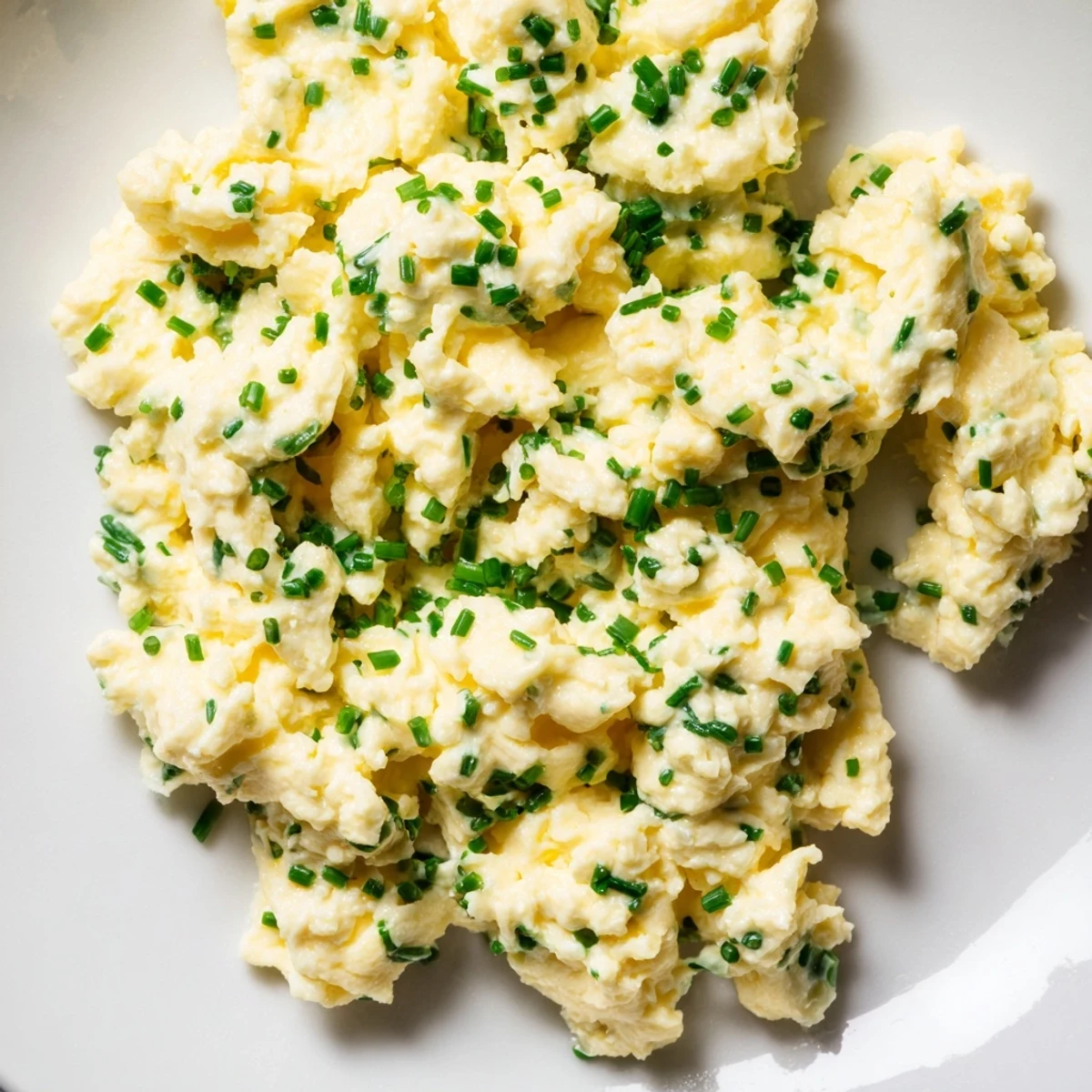 Delicious cottage cheese scrambled eggs; the creamy, flavorful breakfast is served hot and ready to eat.