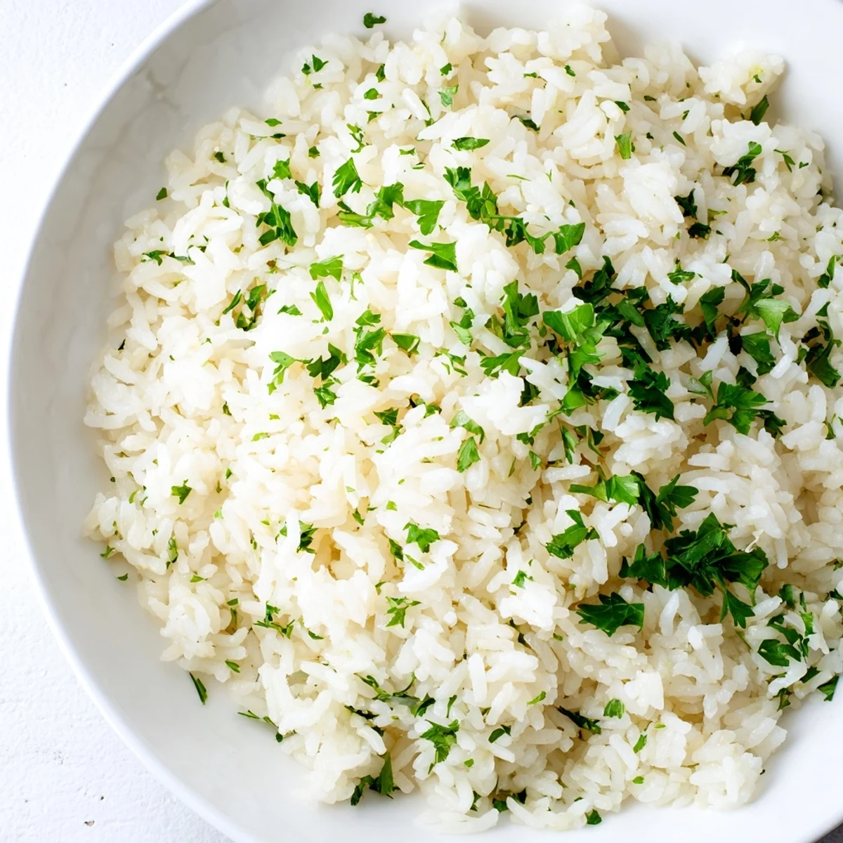 Fragrant garlic butter rice with fluffy grains, ready to be served alongside a main course.