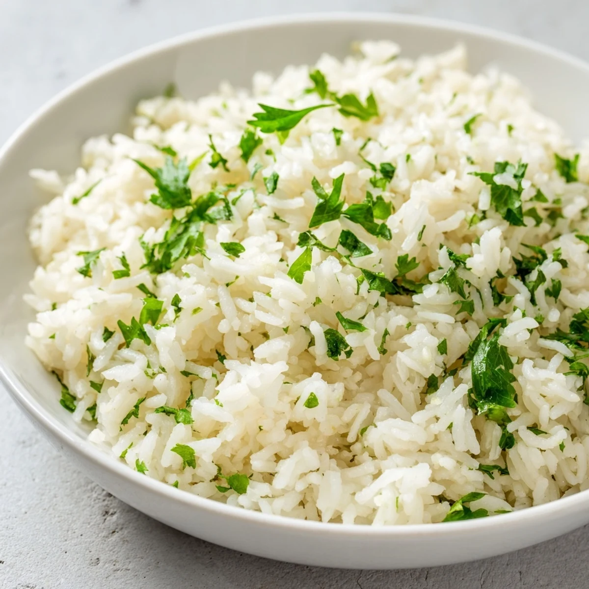 Steaming bowl of delicious garlic butter rice, a simple yet satisfying accompaniment to a meal.