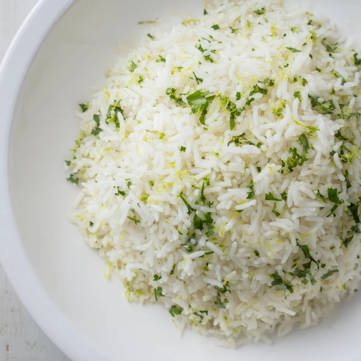 Fluffy cilantro lime rice, bright green with cilantro, ready to serve as a side dish.