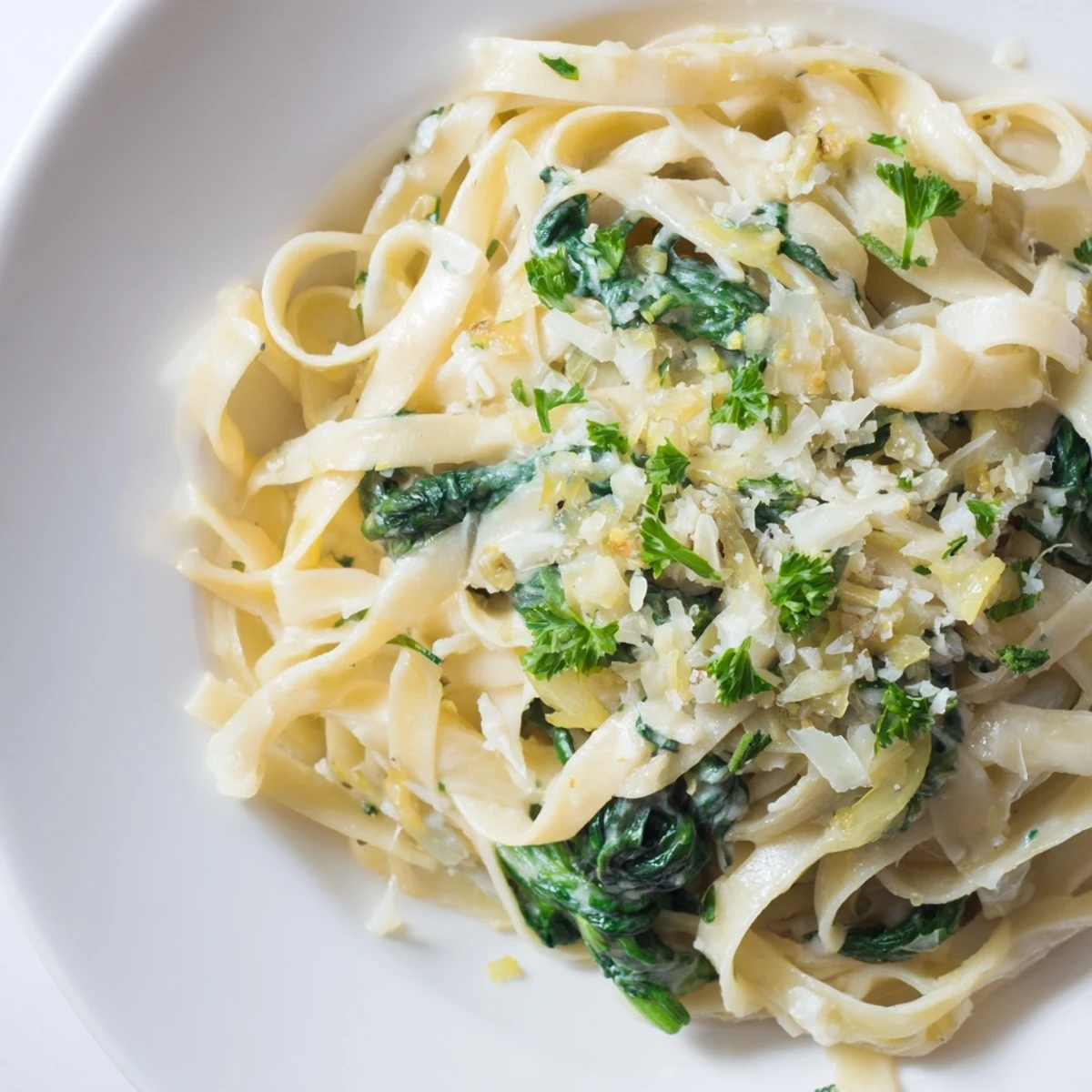 Delicious Creamy Garlic Spinach Pasta, plated beautifully, ready to be enjoyed as a hearty meal.