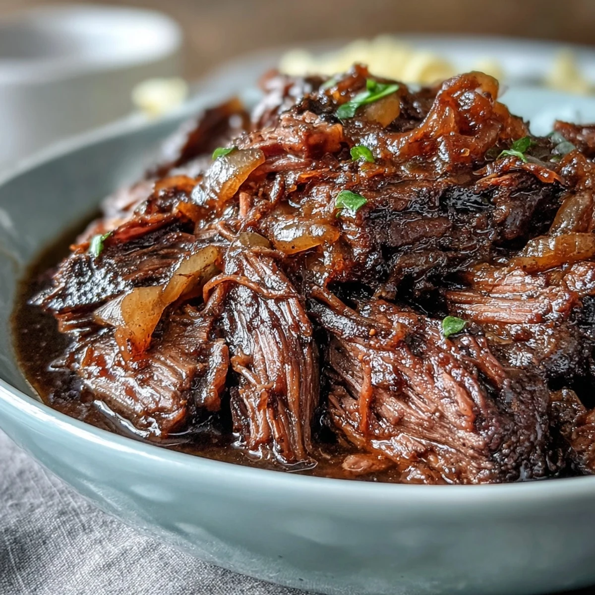 Slow-cooked Crockpot French Onion Pot Roast Pasta featuring rich beef gravy and melted Gruyère over noodles.