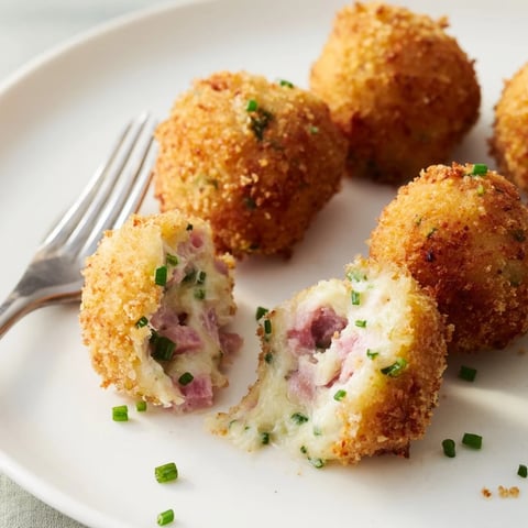 Crispy Black Forest ham croquettes golden-fried to perfection, ideal for appetizers.  