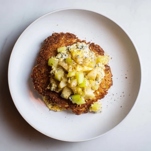 Golden-brown budget potato pancakes served with creamy Gorgonzola-apple compote, ready to eat.