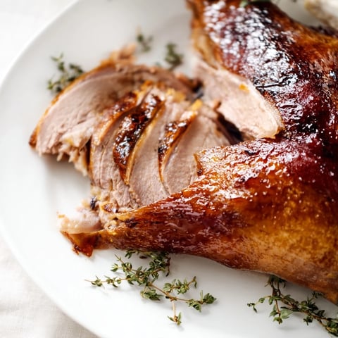 Golden-brown Festive Roast Goose with Asian Five-Spice, ready for carving and serving at a holiday feast.