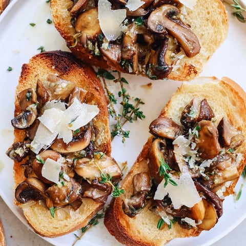 Golden, toasted Bruschetta with roasted mushrooms and fresh parsley, a delightful appetizer ready to serve.