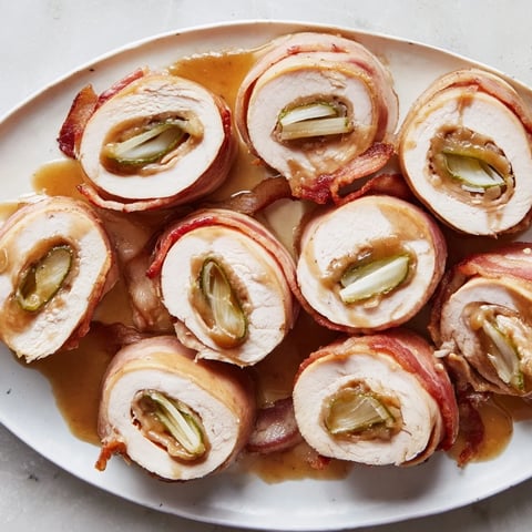 Tender Quick Chicken Rouladen Rolls are browned and beautifully rolled with bacon and pickles, ready to bake.