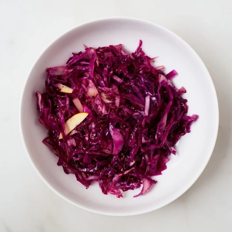 Tender Bavarian red cabbage and apple, a classic German side dish with a sweet and tangy flavor.