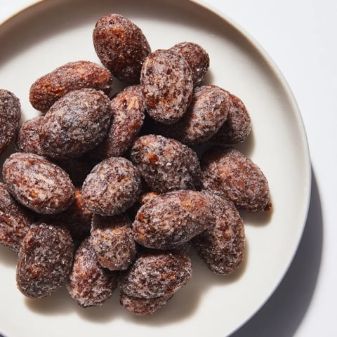 Golden brown Quick Glühwein Spiced Almonds, a warm, fragrant snack perfect for winter gatherings.