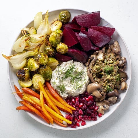 A vibrant Pine Forest Winter Mezze Board, showcasing roasted vegetables and herbed labneh for sharing.