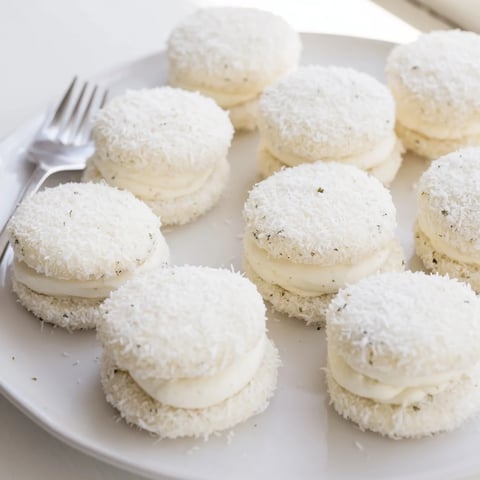 Delicate Snowball Tea Sandwich Bites, rolled in coconut, a classic treat for any tea party.
