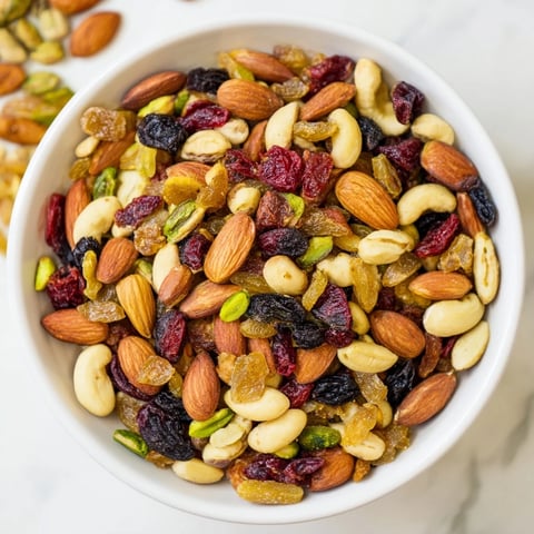 Assorted Nuts and Dried Fruit: A colorful pile of mixed nuts and dried fruit, ready for a party.