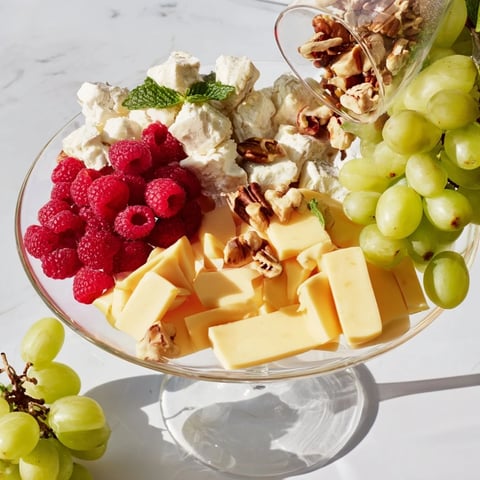 Golden light bathes the Champagne Waterfall Board, a festive grazing board ready to impress.