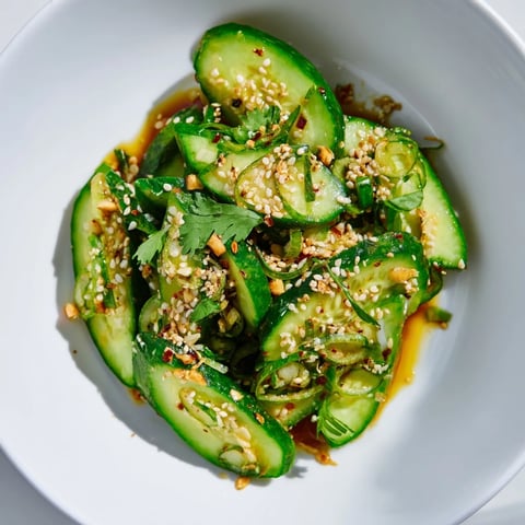 Fresh Zesty Shake Cucumber Salad with sesame seeds, cilantro, ready to serve after chilling.