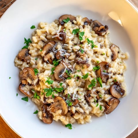Creamy mushroom risotto, a close-up showing the rich, savory dish before serving.