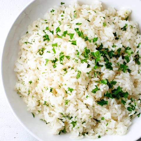 Fragrant garlic butter rice with fluffy grains, ready to be served alongside a main course.