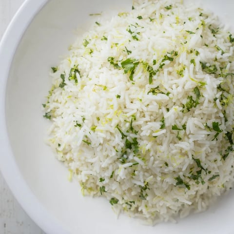 Fluffy cilantro lime rice, bright green with cilantro, ready to serve as a side dish.