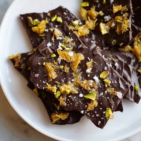 Crispy Kataifi Chocolate Crunch Bark with pistachios, ready to break and enjoy that satisfying crunch.