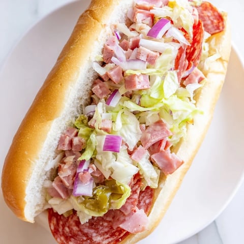 Chopped Italian Grinder sandwich, a hearty Italian-American delight overflowing with savory meats and fresh veggies.