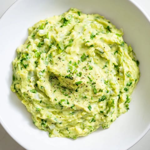 Creamy Avocado Lime Dip, a bright green dip, served with crispy tortilla chips, perfect snack.