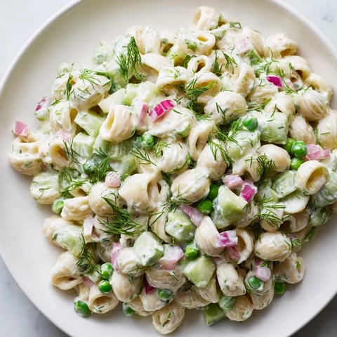 Creamy dill pickle pasta salad, a delightful American side dish, chilled and ready to serve.