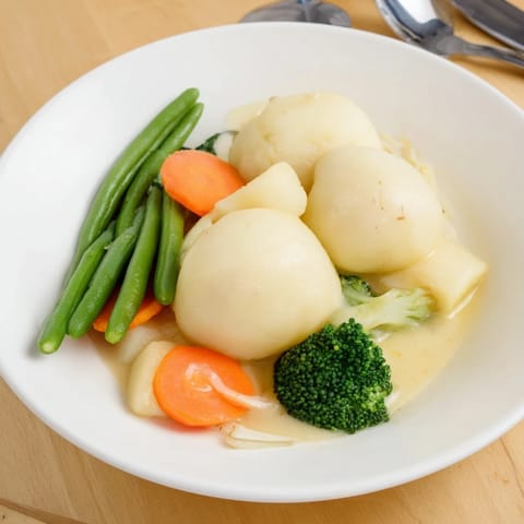 Kartoffelklöße mit Sauce Gemüse