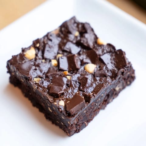 Warm, gooey Lightened Hazelnut Brownies cooling after baking, ready for serving as a dessert.