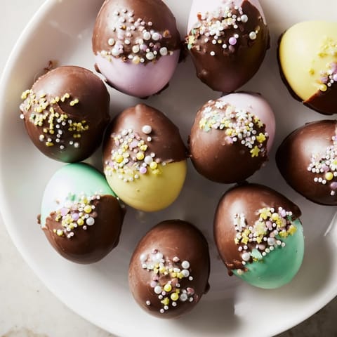 Homemade Easter candy eggs, showing colorful sprinkles, inviting you to bake this amazing treat.