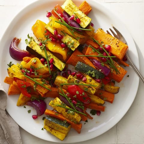 Vibrant Christmas Present Veggie Crates, garnished with fresh chives and pomegranate seeds, ready to serve.