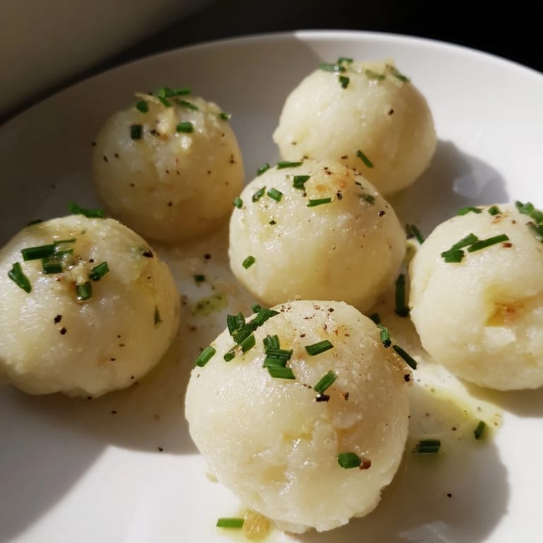 Imagine savory German potato dumplings, perfectly cooked and topped with chives and truffle oil.