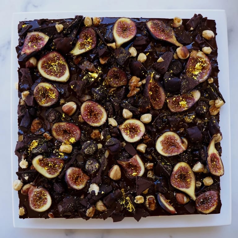 Imagine a square of the "Midnight Mosaic" dessert, with figs, olives, and chocolate shining.