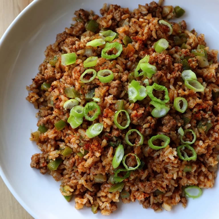 Hearty Cajun Dirty Rice, cooked with flavorful ground meat and vegetables, ready to serve and taste.