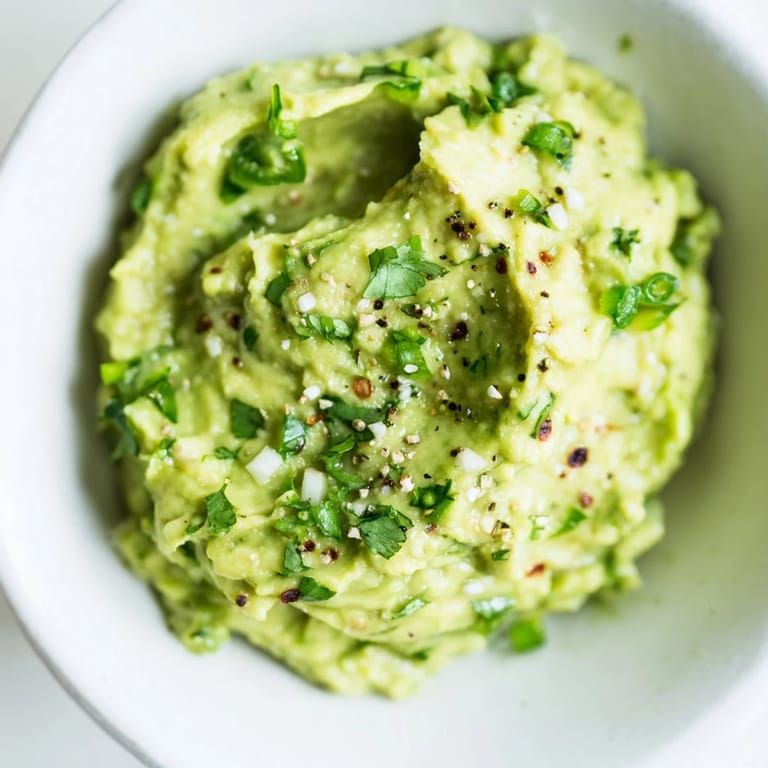Fresh Avocado Lime Dip, chunky and vibrant, ready to be scooped up and enjoyed with friends.